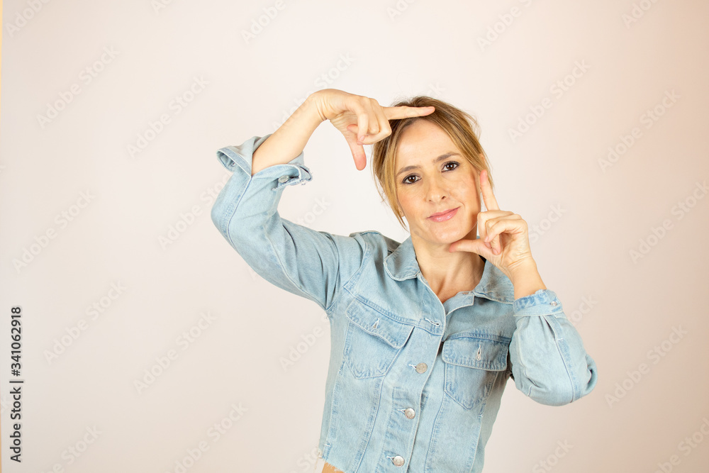 Young woman making portrait gesture Young woman making portrait gesture