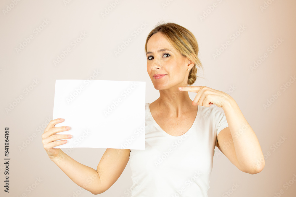 Beautiful woman with paper looking into the camera Beautiful woman with paper looking into the camera