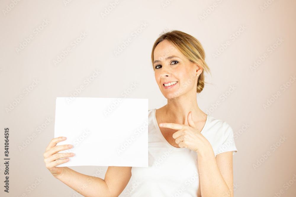Beautiful woman with paper looking into the camera Beautiful woman with paper looking into the camera