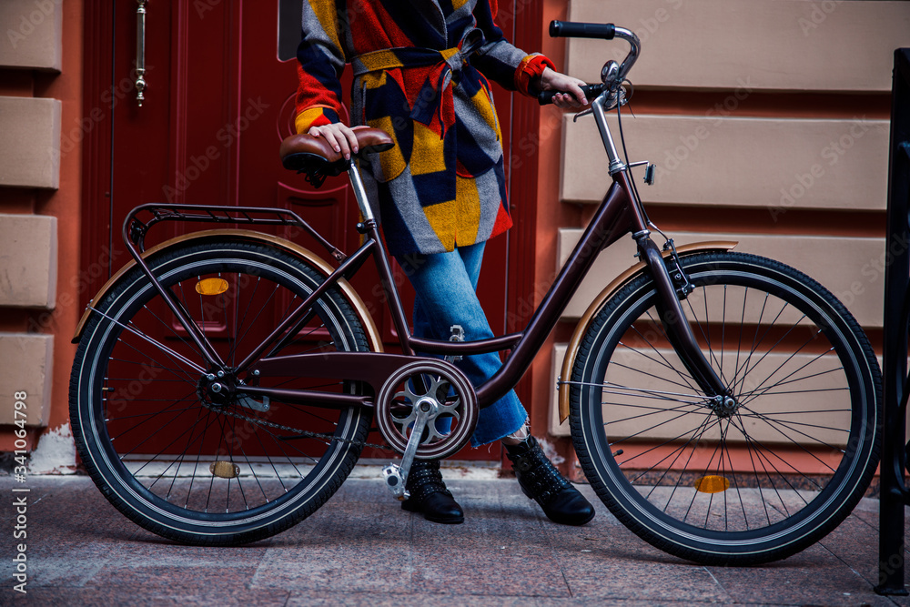 Beautiful bike and woman standing behind it stock photo Beautiful bike and woman standing behind it stock photo