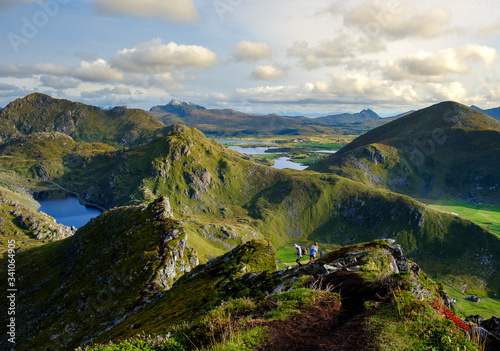 trekking on the Lofoten islands, a couple on top of a mountain range