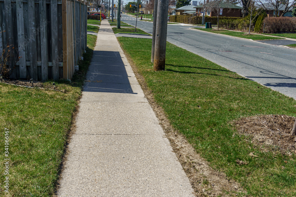 Empty and deserted road and sidewalk during the covid-19 pandemic Empty and deserted road and sidewalk during the covid-19 pandemic