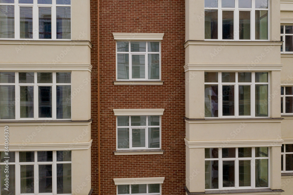 The property. New modern building with balconies, close-up, fragment. Close-up of glass balconies of modern hotel building The property. New modern building with balconies, close-up, fragment. Close-up of glass balconies of modern hotel building