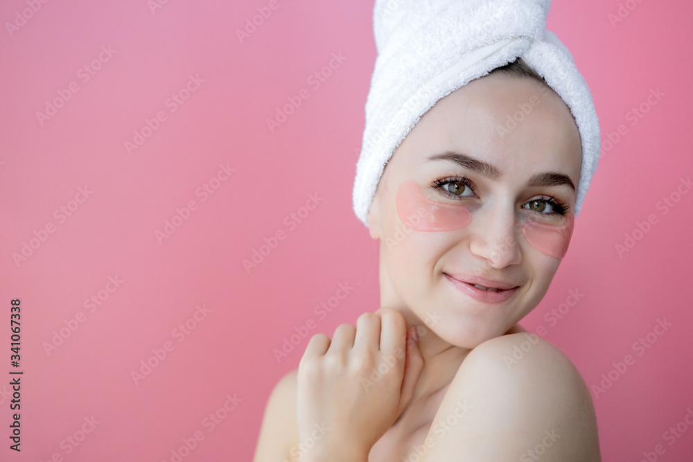 Portrait of Beauty Woman with Eye Patches on pink background. Woman Beauty Face with Mask under Eyes. Skin care, cosmetic product concept with copy space Portrait of Beauty Woman with Eye Patches on pink background. Woman Beauty Face with Mask under Eyes. Skin care, cosmetic product concept with copy space