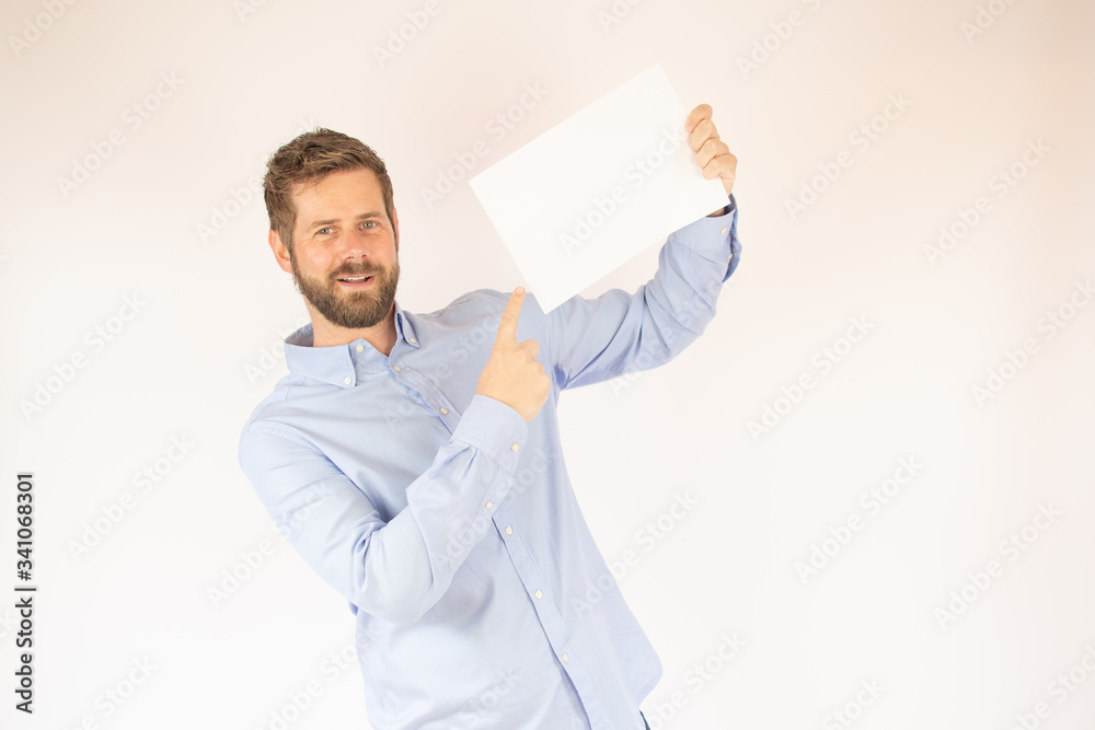 handsome young man in blue shirt with paper handsome young man in blue shirt with paper