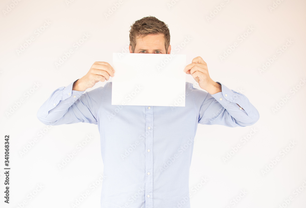 handsome young man in blue shirt with paper handsome young man in blue shirt with paper