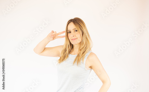 Beautiful woman making a victory gesture