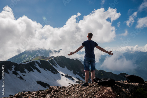 man on top of mountain