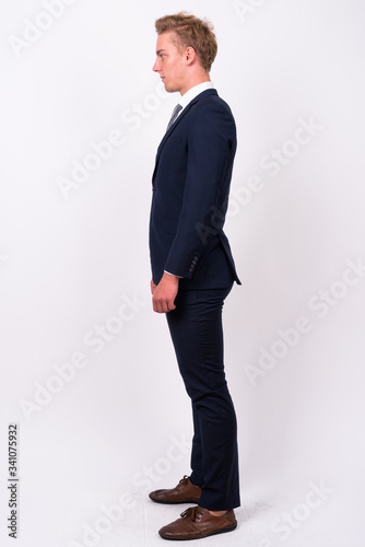 Young handsome Scandinavian businessman against white background