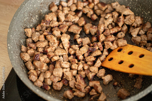 fried meat in a pan