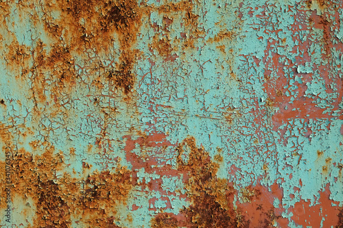 Metal rusty surface with shabby background paint. Texture blue cracked paint on an iron sheet. Fragment of an old metal gate, Metal Corrosion
