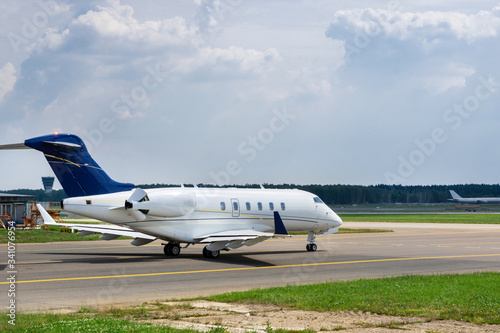 Business jet moves on taxiway to the runway © alhim