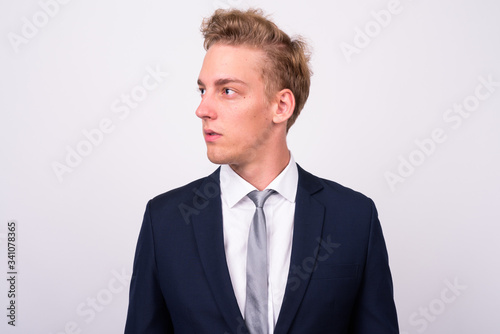 Young handsome Scandinavian businessman against white background