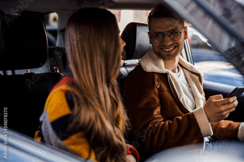 Happy couple talking and looking at each other in the car stock photo © Yakobchuk Olena