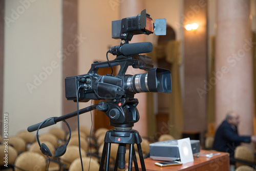 Professional production video camera . video camera set on a tripod with excellent clipping path .