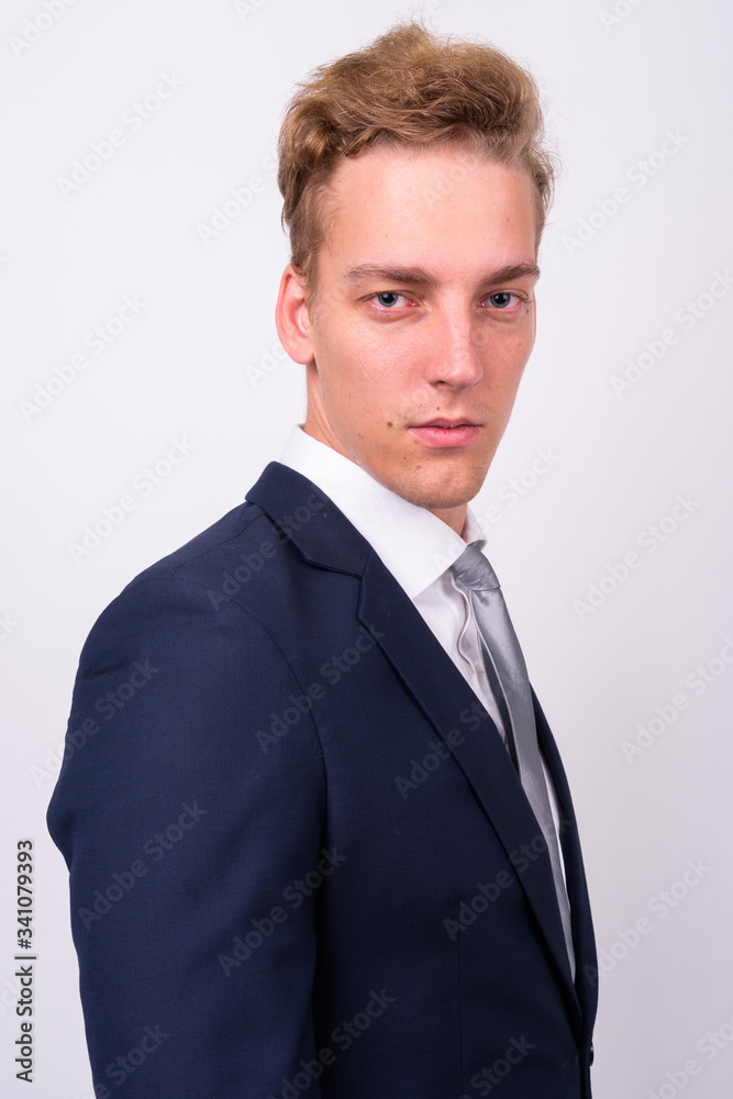 Young handsome Scandinavian businessman against white background Young handsome Scandinavian businessman against white background