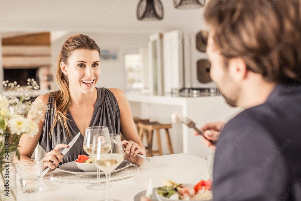 Portrait of young woman having dinner with boyfriend Portrait of young woman having dinner with boyfriend