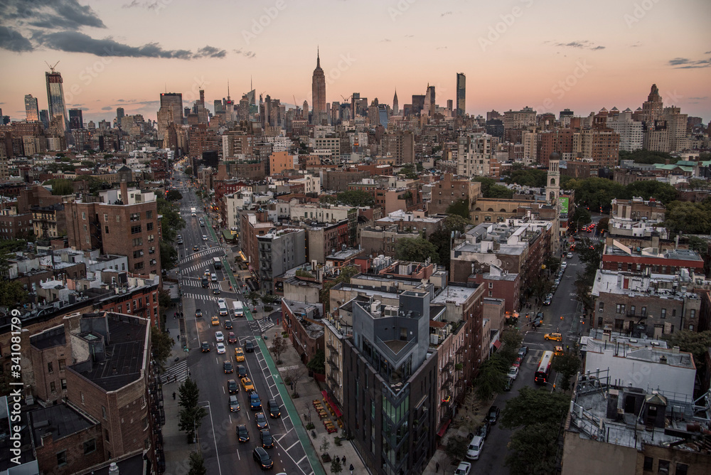 epic rooftop view of manhattan skyline with main boulevard at sunset