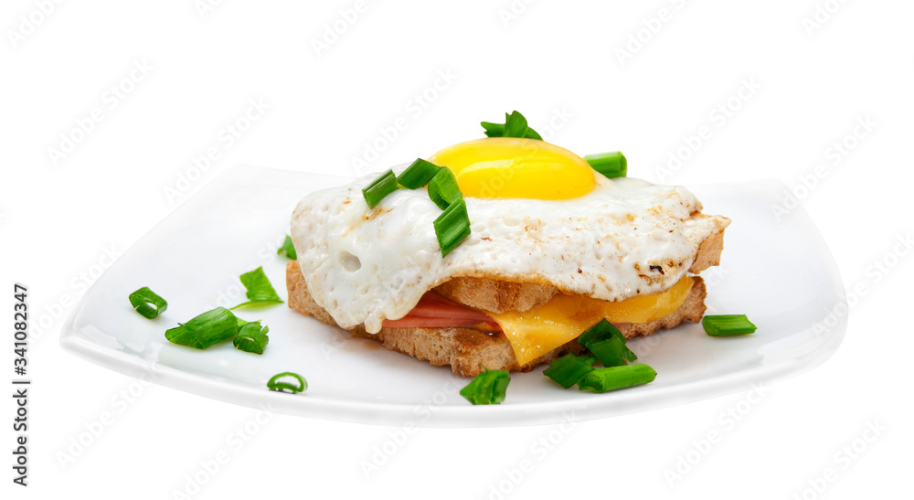 Sandwich with ham and fried eggs cheese on a white plate. White background. Isolated object Sandwich with ham and fried eggs cheese on a white plate. White background. Isolated object