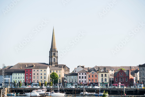 Vászonkép church steeple above colorful irish village of waterford ireland