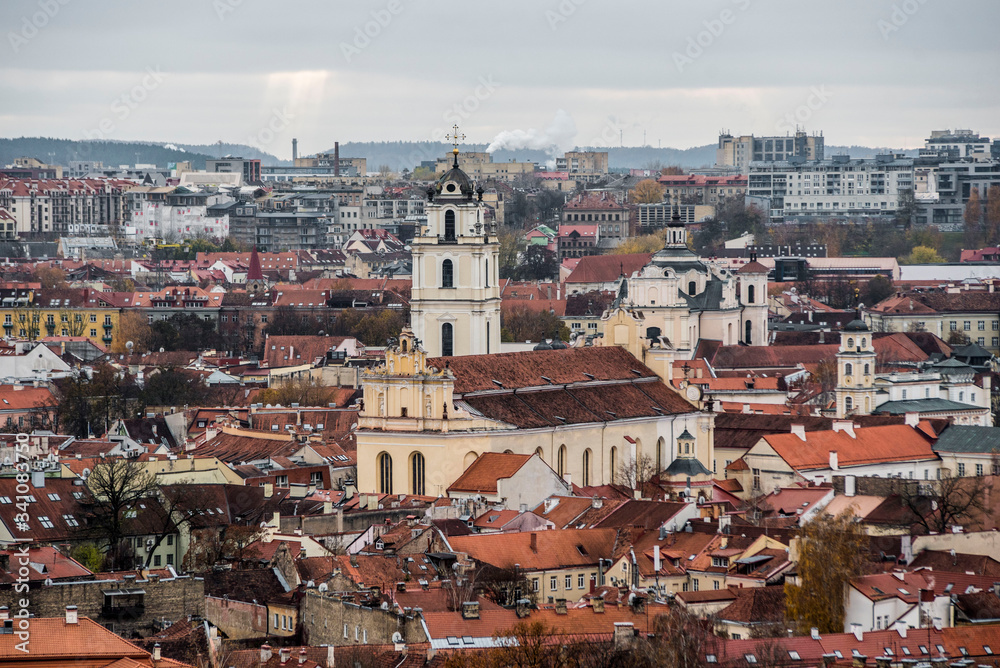 panoramic view of old town vilnius with church and orange roofs