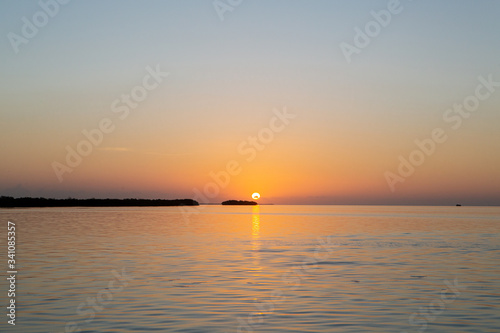 Sunset in quiet beach of the Mayan Riviera