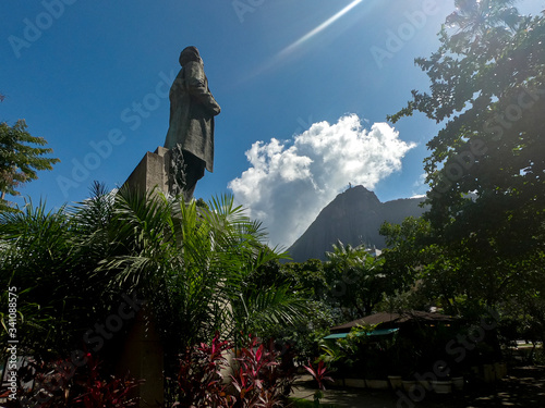 Statue of Brazilian statesman and writer Quinino Antonio Ferreira Bocaiuva in a square with Corcovado mountain and Christ statue in the background