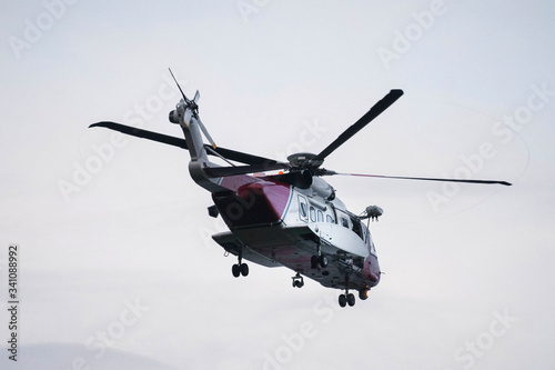 Fototapeta Naklejka Na Ścianę i Meble -  Scottish coastguard helicopter in air