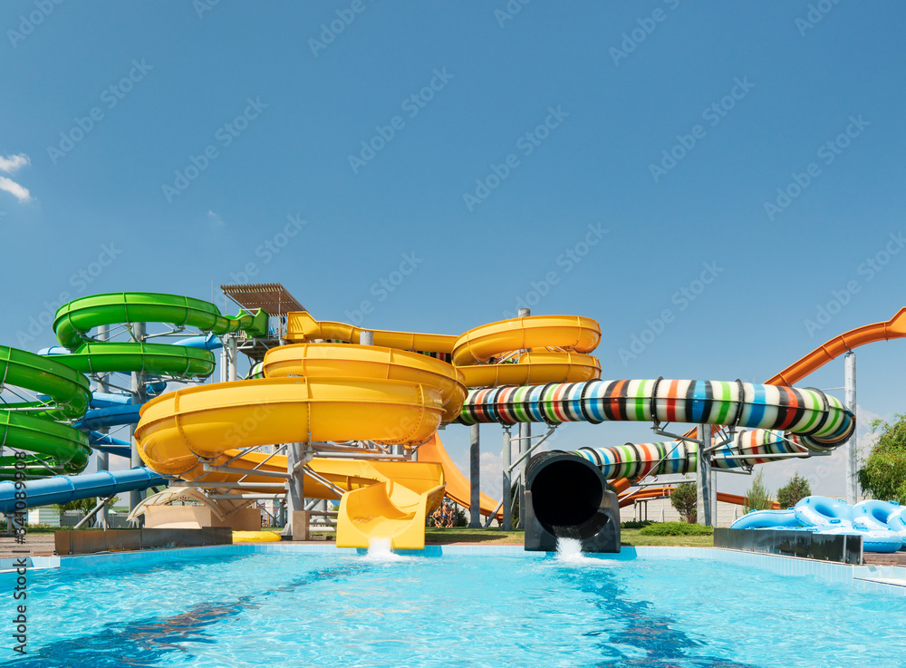 Water park with colorful slides and pools - obrazy, fototapety, plakaty 