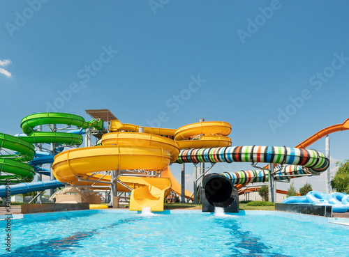 Fototapeta Naklejka Na Ścianę i Meble -  Water park with colorful slides and pools