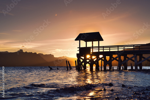 Sunrise with a wooden pier © VanWido
