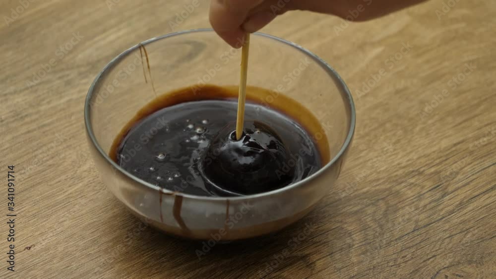 dipped in the melted black chocolate dipped in the melted black chocolate