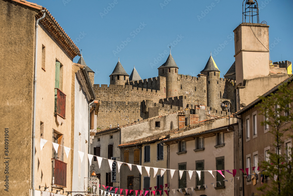 carcassonne castle towers above small european village