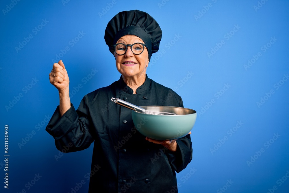 Senior beautiful grey-haired chef woman wearing cooker uniform and hat using whisk and bowl screaming proud and celebrating victory and success very excited, cheering emotion Senior beautiful grey-haired chef woman wearing cooker uniform and hat using whisk and bowl screaming proud and celebrating victory and success very excited, cheering emotion