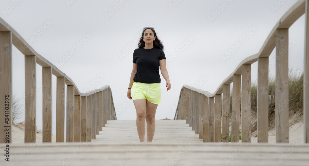 Walking on a pier over the sandy beaches - travel photography