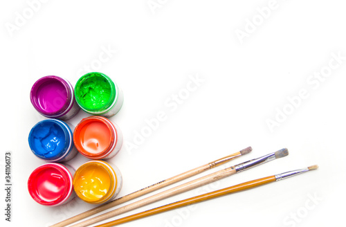 Wallpaper Mural Jars with colorful art paint and brushes are on a white background. Torontodigital.ca