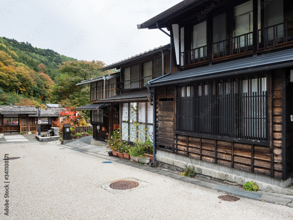 Traditional houses in historic district of Kiso-Fukushima, an old post town along Nakasendo road - Nagano prefecture, Japan