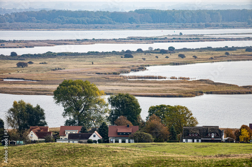 Hiddensee, Germany, 10-15-2019, Hiddensee Island in the Western Pomerania Lagoon Area/ View over the village of Grieben to the Bessin and the island of Rügen photo