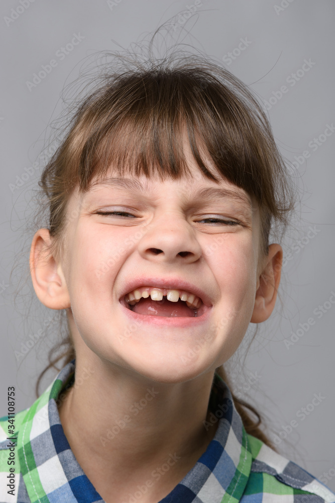 Portrait of a joyfully smiling ten-year-old girl of European appearance, close-up Portrait of a joyfully smiling ten-year-old girl of European appearance, close-up