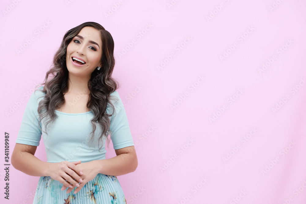 Young woman over isolated pink background doing happy gesture Young woman over isolated pink background doing happy gesture
