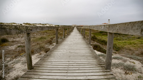Pier over the dunes at the coast - travel photography © 4kclips