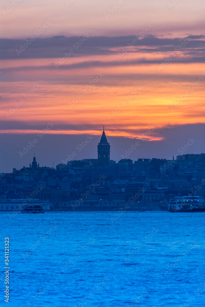 Beyoglu, Istanbul, Turkey, 24 May 2007: Galata Tower, City Lines Ferry, King of Byzantine Anastasius, 528, Sunset.