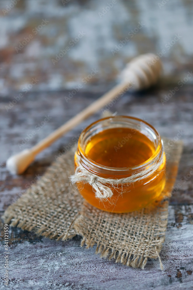 Fresh honey. Jar of flower honey. Stick for honey. Fresh honey. Jar of flower honey. Stick for honey.