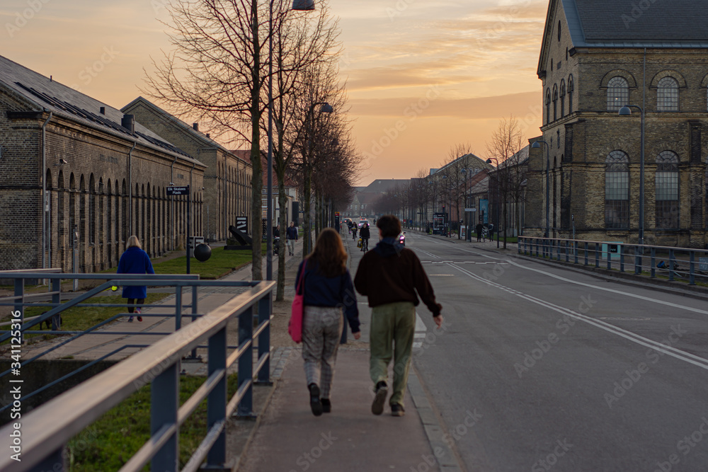 couple walking and sunset on the city, Copenhague denmark