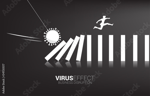 Silhouette of businessman jumping away on collapse domino from corona virus effect. business concept of business disruption and domino effect from pandemic.
