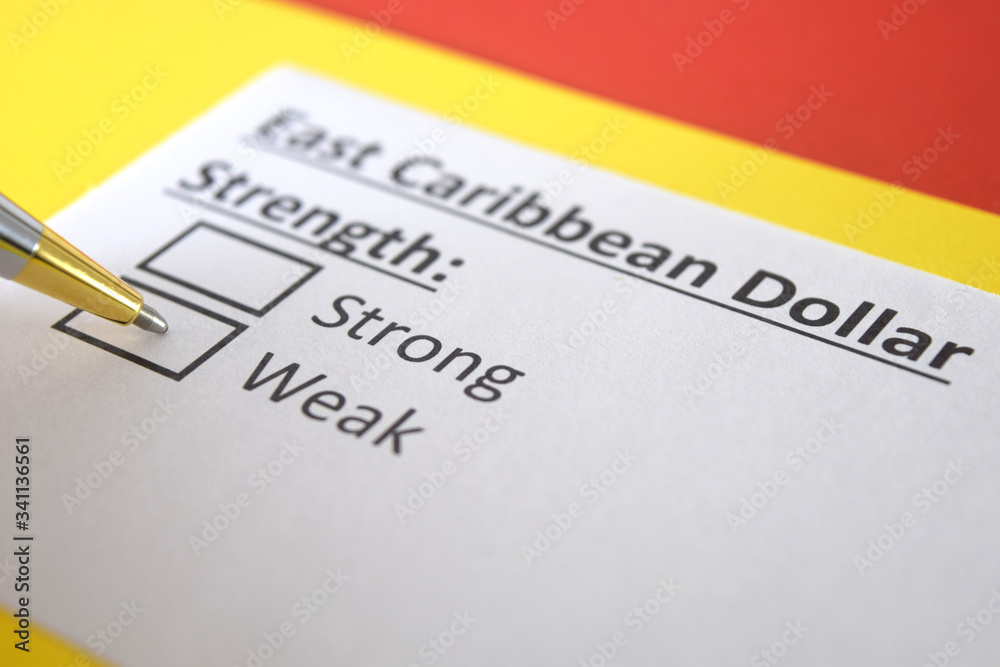 One person is answering question about strength of East caribbean dollar. One person is answering question about strength of East caribbean dollar.