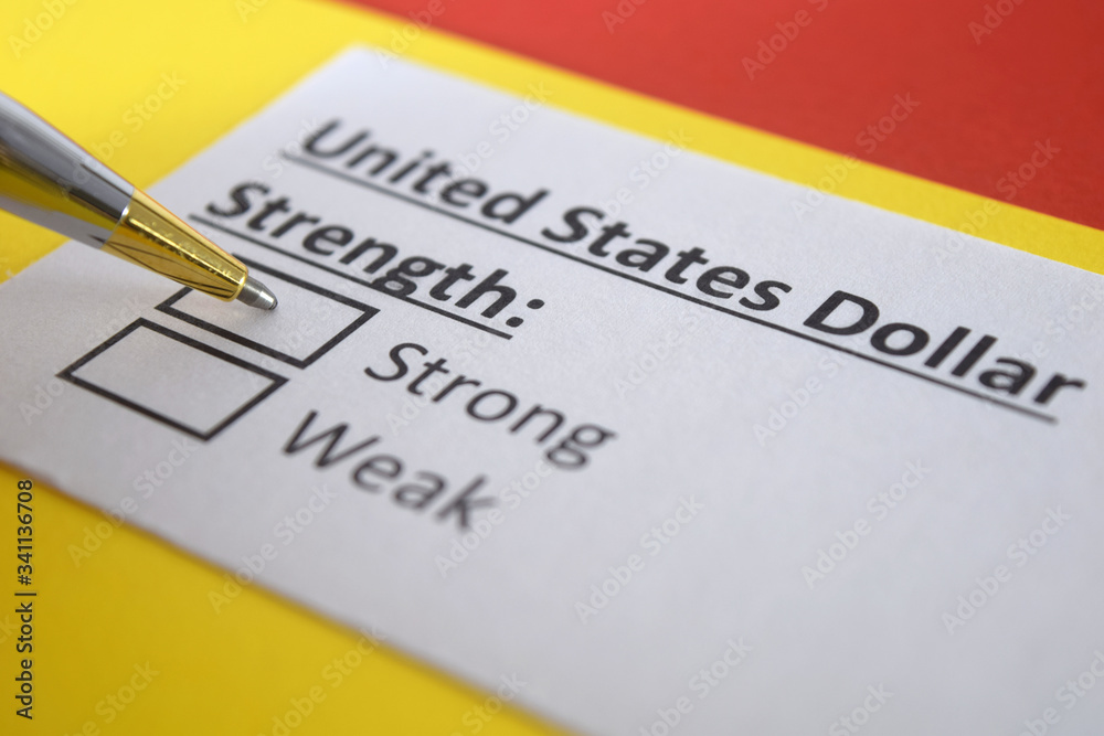 One person is answering question about strength of united states dollar. One person is answering question about strength of united states dollar.