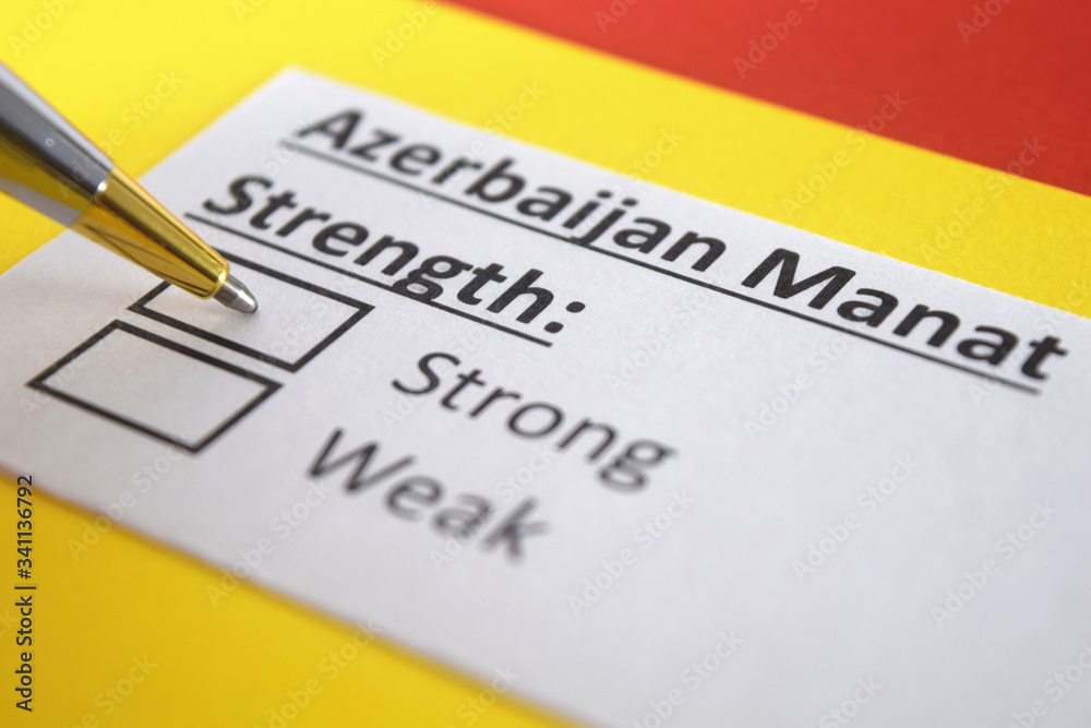 One person is answering question about strength of Azerbaijan Manat. One person is answering question about strength of Azerbaijan Manat.