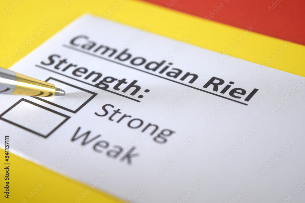 One person is answering question about strength of cambidian riel. One person is answering question about strength of cambidian riel.
