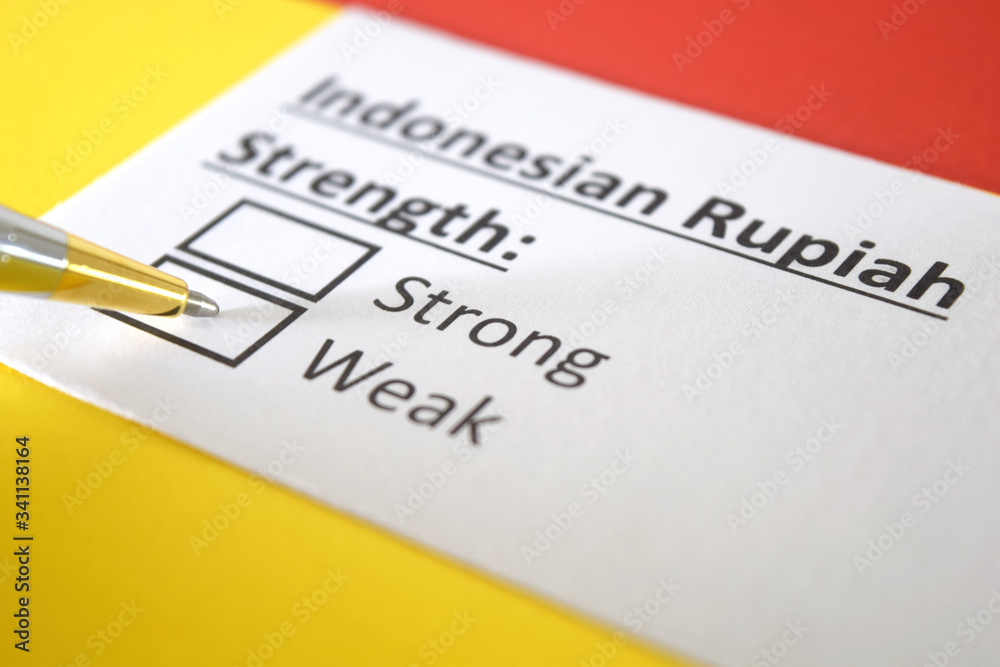 One person is answering question about strength of Indonesian Rupiah. One person is answering question about strength of Indonesian Rupiah.